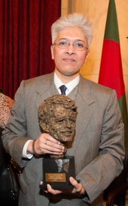Adilur Rahman Khan poses with the Robert F. Kennedy Human Rights Award